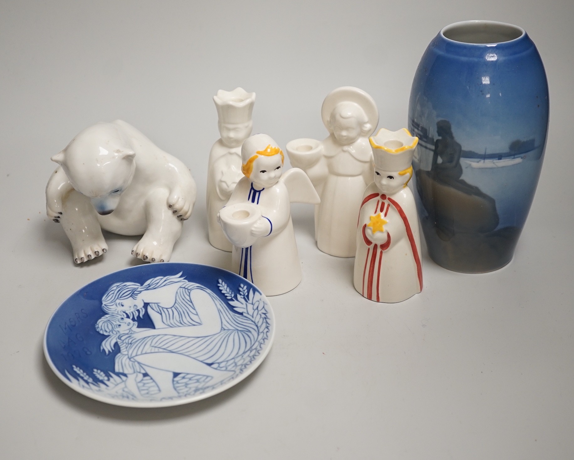 A group of Royal Copenhagen porcelain figural candle holders, a vase, the figure of a polar bear cub and a Mother’s Day dish